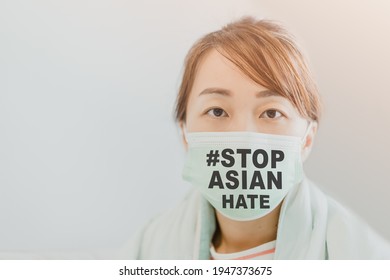 Stop Asian Hate.Stop Spread Of Racism.Asian Woman With Mask Fears Xenophobia At Home.Anti Racist.protester.hate Crimes Against Asians.Support Asian American Communities.Equality.diversity.