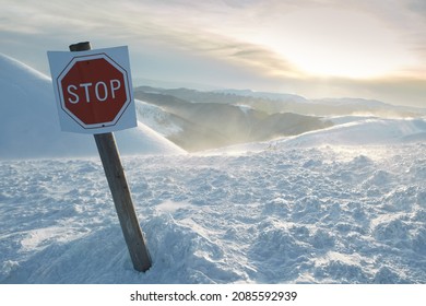 Stop. Avalanche Sign In Front Of Winter Snowy Mountains. Danger Sings On Winter Skiing Resort