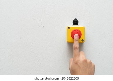 Stop Button and the Hand of Worker About to Press it. emergency stop button. Big Red emergency button or stop button for manual pressing. - Shutterstock ID 2048622305