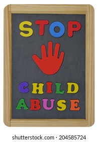Stop child abuse in colored letters written on traditional slate 