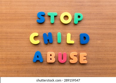 stop child abuse  colorful words on the wooden background