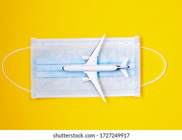 STOP Coronavirus And Travel Concept, Plane With Mask. Coronavirus Alert.