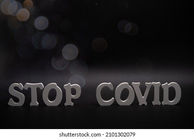 Stop covid-19 concept. text stop covid-19 on dark background, awareness campaign on social media for prevention of coronavirus during the covid-19 epidemic outbreak.