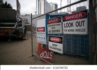 Stop, Danger, No Entry On Construction Building Site Sign, Look Out For Moving Vehicles, Deep Excavation At Downtown Perth City CBD, Western Of Australia  