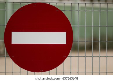 Stop, deny, do not, no entry sign, access denied/restricted on a metal fence background - Shutterstock ID 637363648