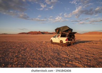 Stop In A Desert Trip On An Off-road Vehicle With A Rooftop Camping Car . Namibia 23 March 2021