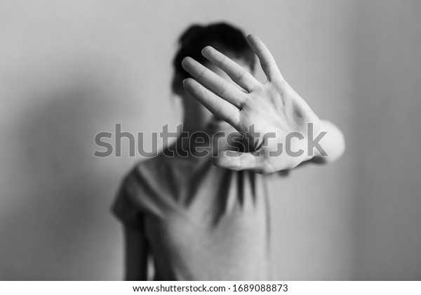 Stop domestic\
violence. The girl covers her face with her hand and asks for help.\
Domestic violence against women.\

