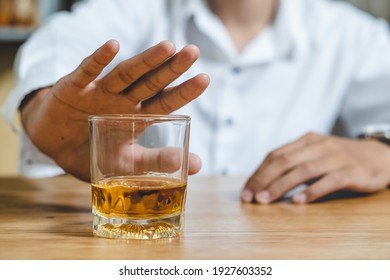 Stop Drunk. Person Push The Glass Of Alcohol Off.