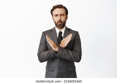 Stop, Enough. Concerned Corporate Man Showing Cross, No Gesture, Deny Something, Rejecting Offer, Standing Over White Background.