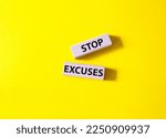 Stop excuses symbol. Concept words Stop excuses on wooden blocks. Beautiful yellow background. Business and Stop excuses concept. Copy space.