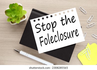 Stop the Foreclosure . text on white page on black notepad - Shutterstock ID 2308285565