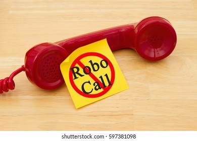 Stop Getting A Call From A Robocall, Retro Red Phone Handset With A Yellow Sticky Note And Text Robocall With Not Icon