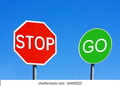 Stop And Go Sign Against A Blue Sky