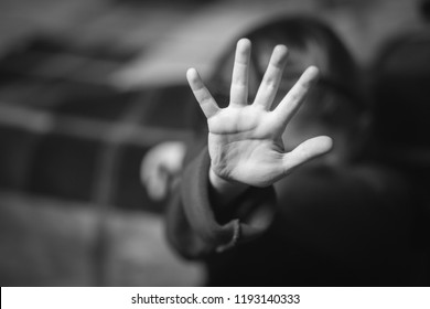 stop hand of child, sign of discrimination or anti violence symbol. Stop abusing violence. Child bondage, violence, terrified, fearful child, Human Rights Day concept..black and white.