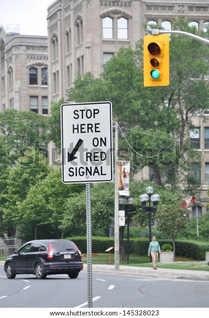 Stop here on red signal\
signage