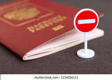 Stop illegal migration concept, Russian passport and stop sign close up - Shutterstock ID 1154356111