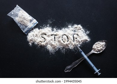 Stop Inscription On Heroin Powder, Spoon And Syringe Cross Concept Death Addiction