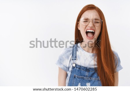 Stop it, cannot bear anymore. Fed up distressed young upset redhead girl long ginger hair complaining yelling, calling mom, close eyes shout out loud displeased, feel pissed and annoyed
