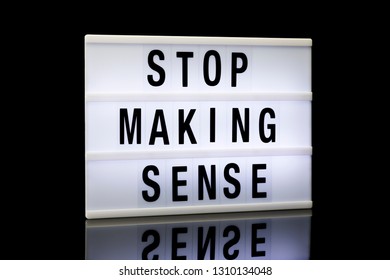 Stop Making Sense, Phrase Written On Lightbox Reflected On Black Background, 