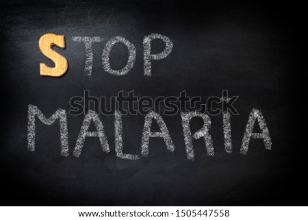 Stop Malaria text on blackboard, health concept background