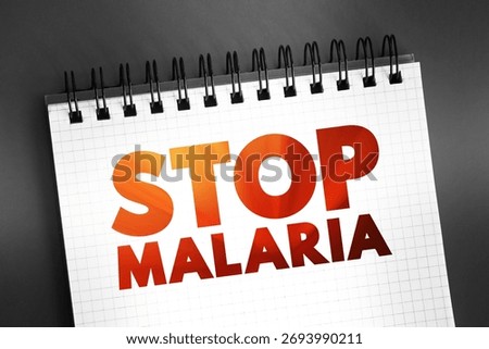 Stop Malaria text on notepad, medical concept background