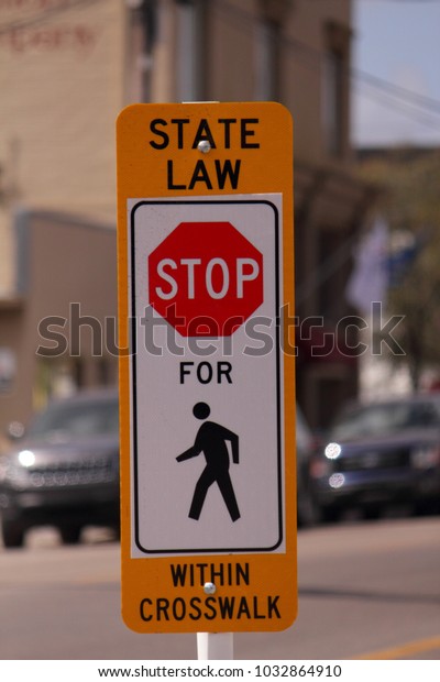 Stop for Pedestrians in\
crosswalk sign