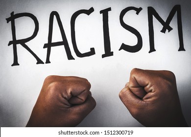 Stop Racism Poster. Children’s Fists Protest Discrimination And Nazism. Racial Problem. Child African Hands Protest Against Inequality. Black Inscription Racism On A White Background