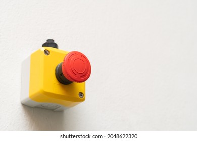 Stop Red Button and the Hand of Worker About to Press it. emergency stop button. Big Red emergency button or stop button for manual pressing. - Shutterstock ID 2048622320