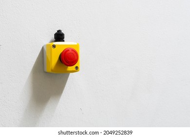 Stop Red Button and the Hand of Worker About to Press it. emergency stop button. Big Red emergency button or stop button for manual pressing. - Shutterstock ID 2049252839