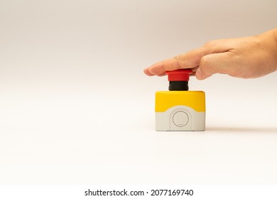 Stop Red Button and the Hand of Worker About to Press it. emergency stop button. Big Red emergency button or stop button for manual pressing.
