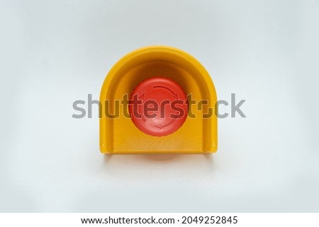 Stop Red Button and the Hand of Worker About to Press it. emergency stop button. Big Red emergency button or stop button for manual pressing.
