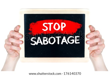 Stop sabotage . Creative composition with the message Stop sabotage woman hold on blackboard