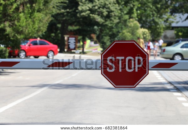 Stop sign on the barrier\
gate
