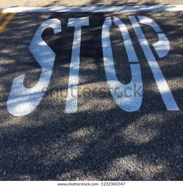 Stop sign painted on\
street