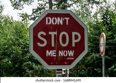 Stop Sign Painted Over With Some Words. Says Don't Stop Me Now.