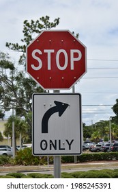 A Stop Sign And Right Turn Only Arrow Sign.