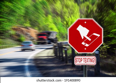Stop sign with a symbol of a handheld device and the words Stop Texting printed on it.  Image is blurred to imply motion and distraction.  Symbol is artist own conceptual design.  