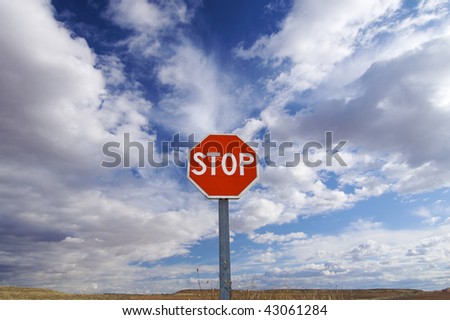 stop signal with cloudy sky