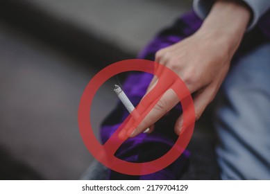 Stop Smoking Cigarettes Concept. Girl Holding Broken Cigarette In Hands. Quit Bad Habit, Health Care Concept. No Smoking.