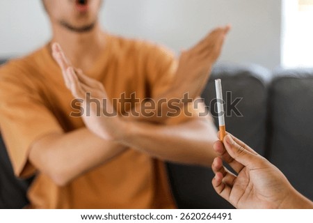 Stop smoking concept. Man refusing cigarettes, closeup.