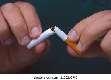 Stop Smoking, Quit Smoking Or No Smoking Cigarettes. Man Holding Broken Cigarette In Hands. Man Refusing Cigarettes. Quit Bad Habit.