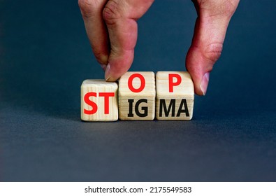 Stop stigma symbol. Concept words Stop stigma on wooden cubes. Businessman hand. Beautiful grey table grey background. Business and Stop stigma concept. Copy space.