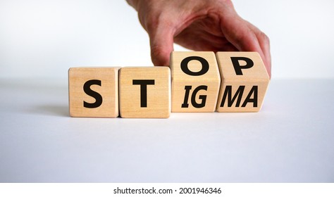Stop stigma symbol. Doctor turns cubes with words stop stigma. Beautiful white background. Medical and stop stigma concept. Copy space.
