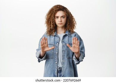 Stop, Taboo Concept. Young Serious Woman Showing No, Prohibit, Rejection Gesture, Forbid Smth Bad, Standing Over White Background.