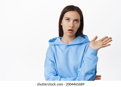 Stop Talking. Annoyed Young Arrogant Woman Do Eye Roll, Wave Away, Telling To Quit Speaking, Bored With Conversation, Standing In Hoodie Against White Background