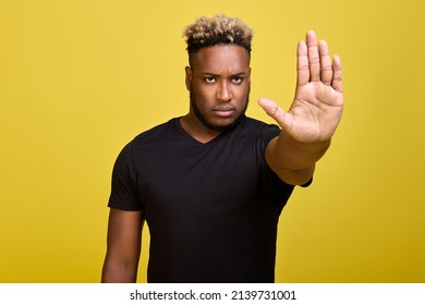 Stop, There Is No Road Here - A Dark-skinned Guy Shows With A Stopping Hand Gesture With A Serious Look. I Don't Want To Listen To This Nonsense Anymore - The Man Shows All His Indignation