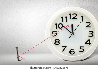 Stop time on clock by rope and nail.Business management and control for period and break overtime concept.