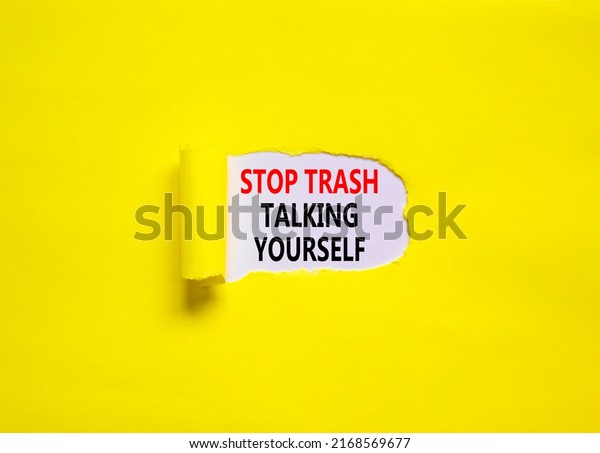 Stop trash\
talking yourself symbol. Concept words Stop trash talking yourself\
on a beautiful yellow background. Psychological and stop trash\
talking yourself concept. Copy\
space.