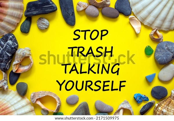 Stop trash talking yourself symbol. Concept words
Stop trash talking yourself on a beautiful yellow background. Sea
stones and seashells. Psychological stop trash talking yourself
concept. Copy space.