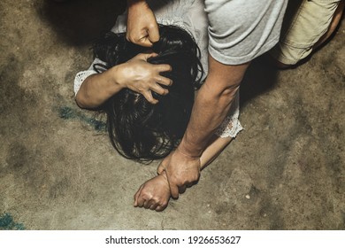 stop violence against women, Girl trying to escape from domestic violence, sexual abuse with a man attacking to a scared woman in a dark place,